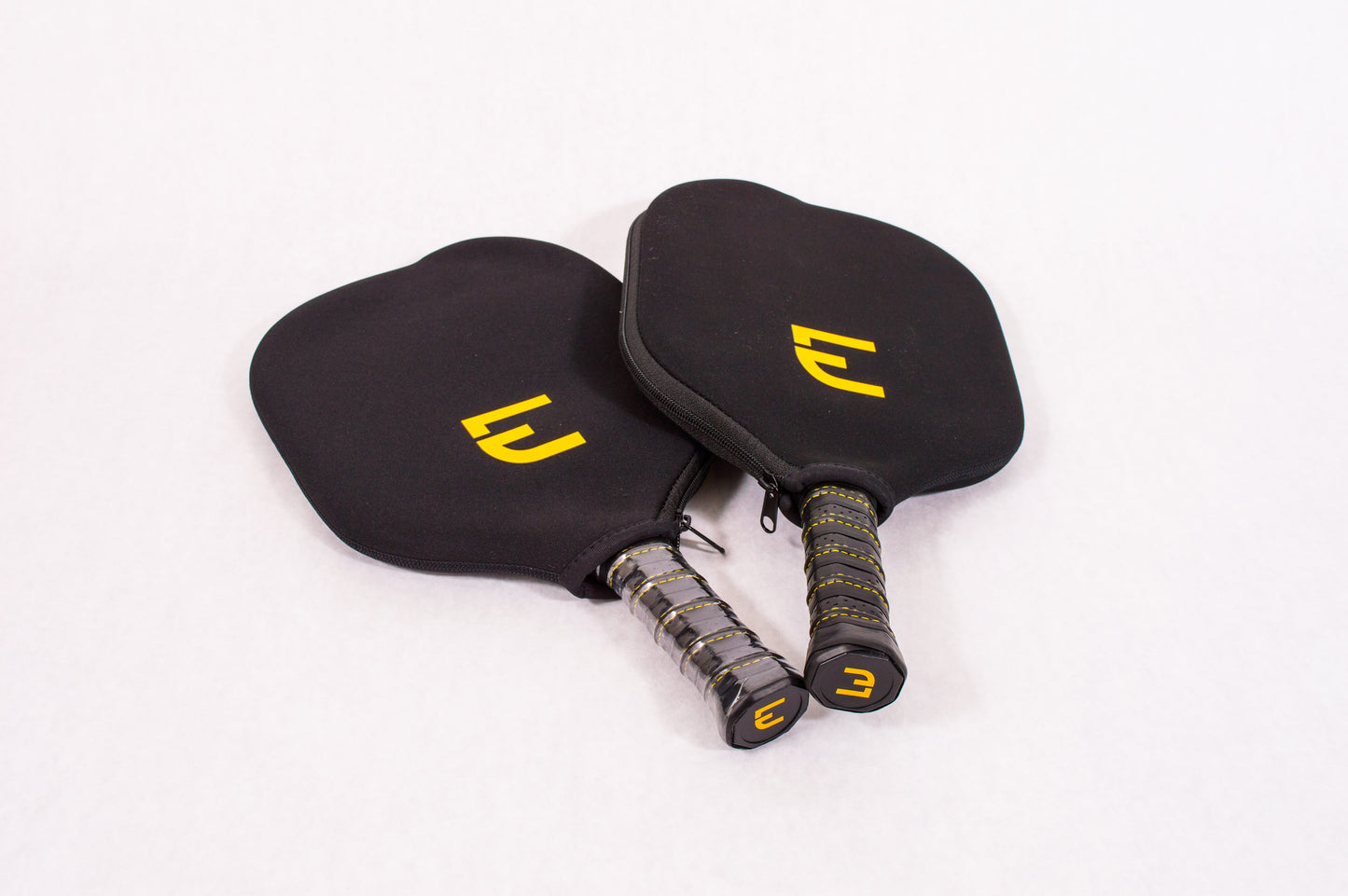 Two Electrum Pro Pickleball Paddles in Protective Electrum Covers